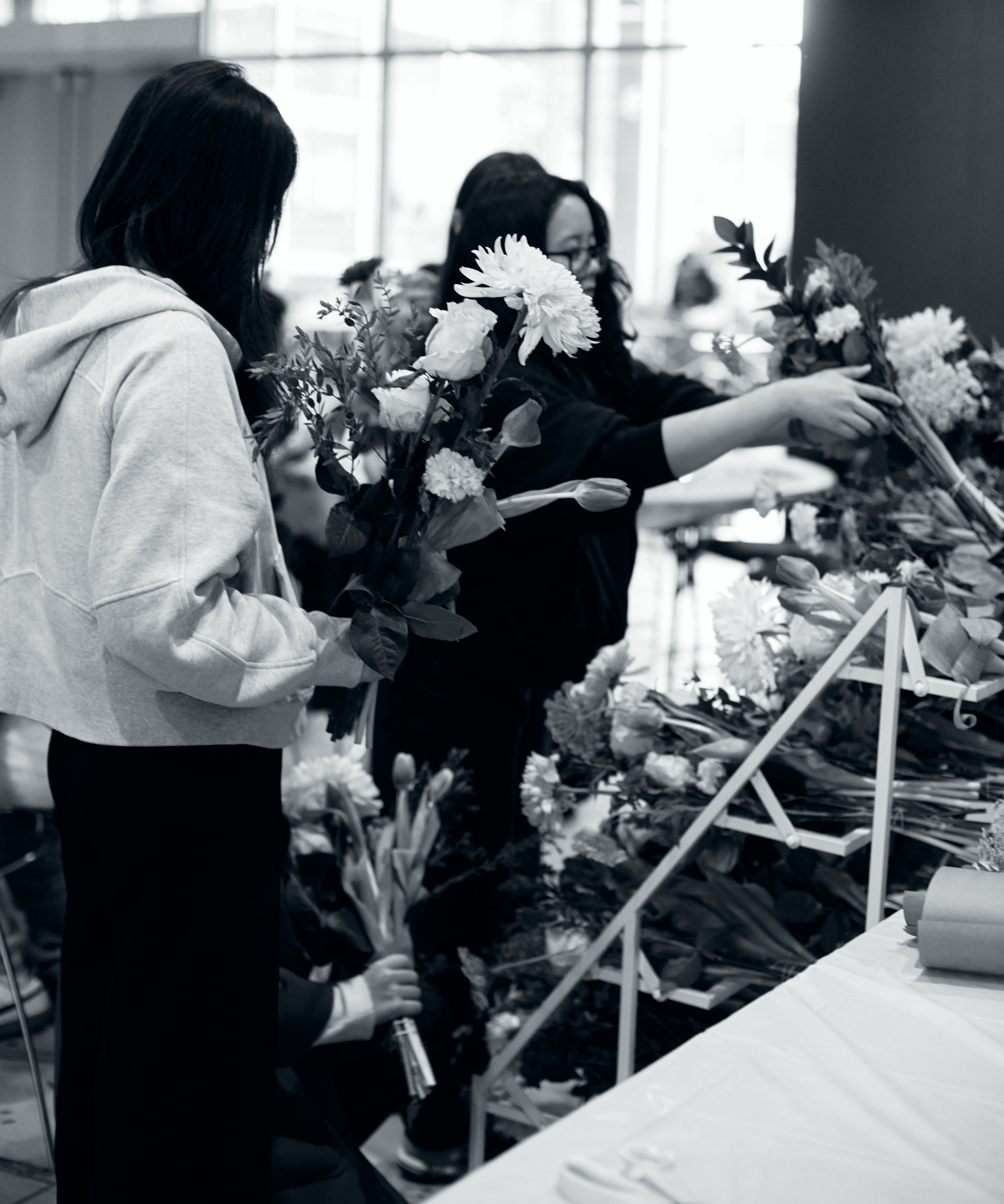 A working session in the atelier, arrangements built around one table